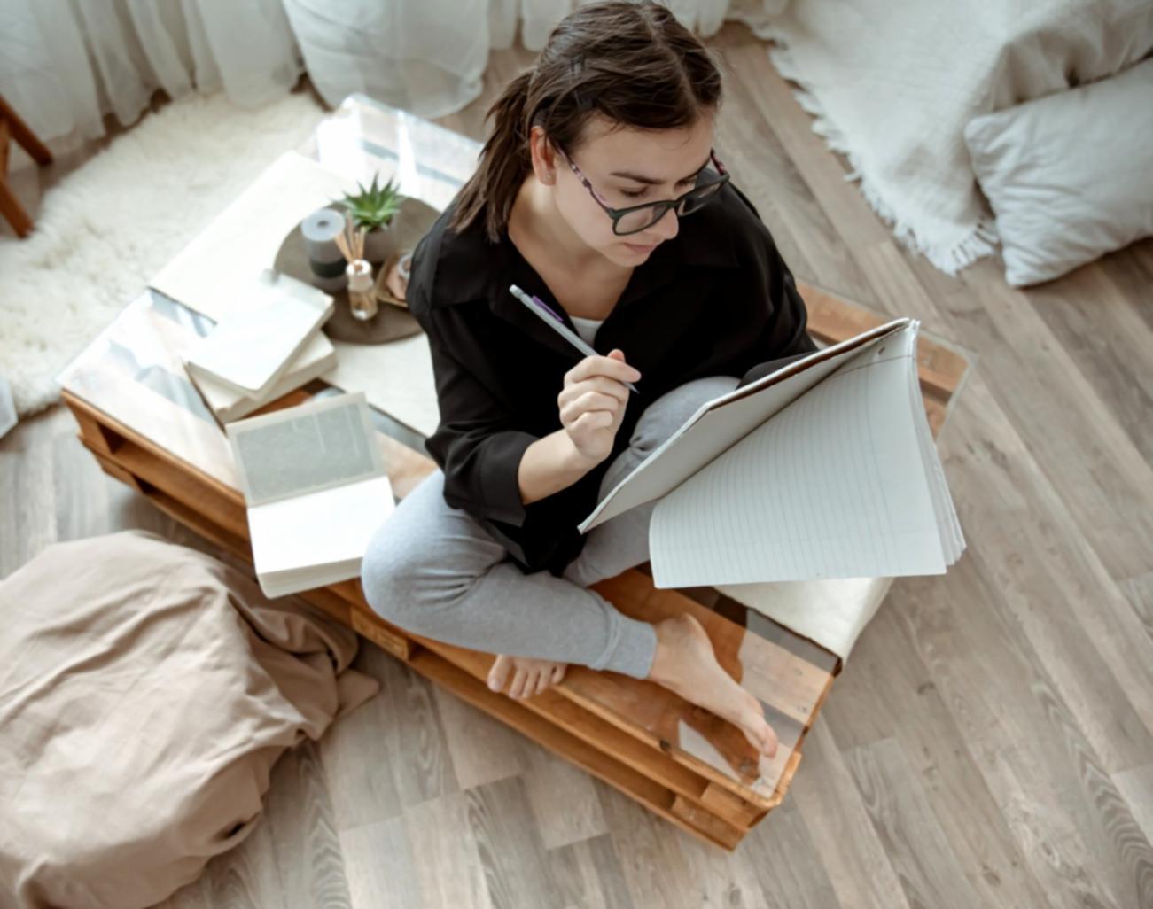 Professional financial analysis workspace showing charts, documents and research materials